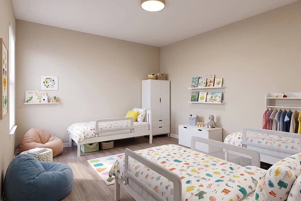 Open-concept kitchen and playroom designed for young families at a Wild Horse Estates model home