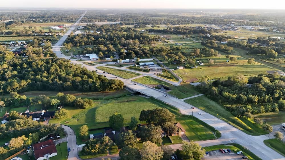 Aerial view of a small Texas community near Bullard, TX with tree-lined streets and open land