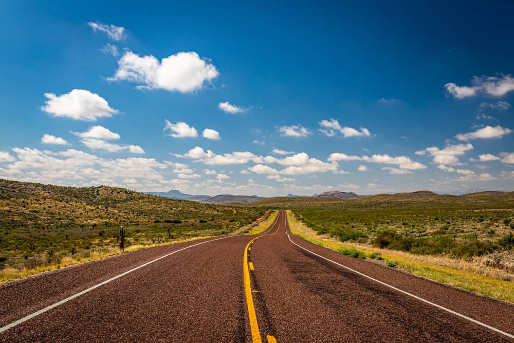 Open rural highway through the countryside near Bullard, TX, reflecting the area's large-lot land availability