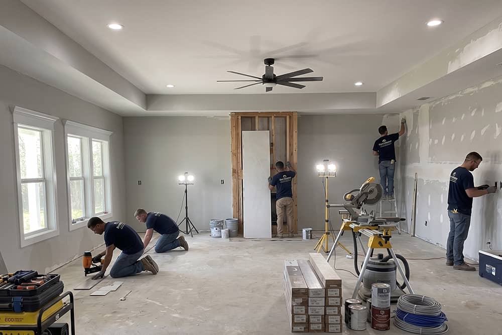 Crew working on interior finish stage of new construction Tyler TX home