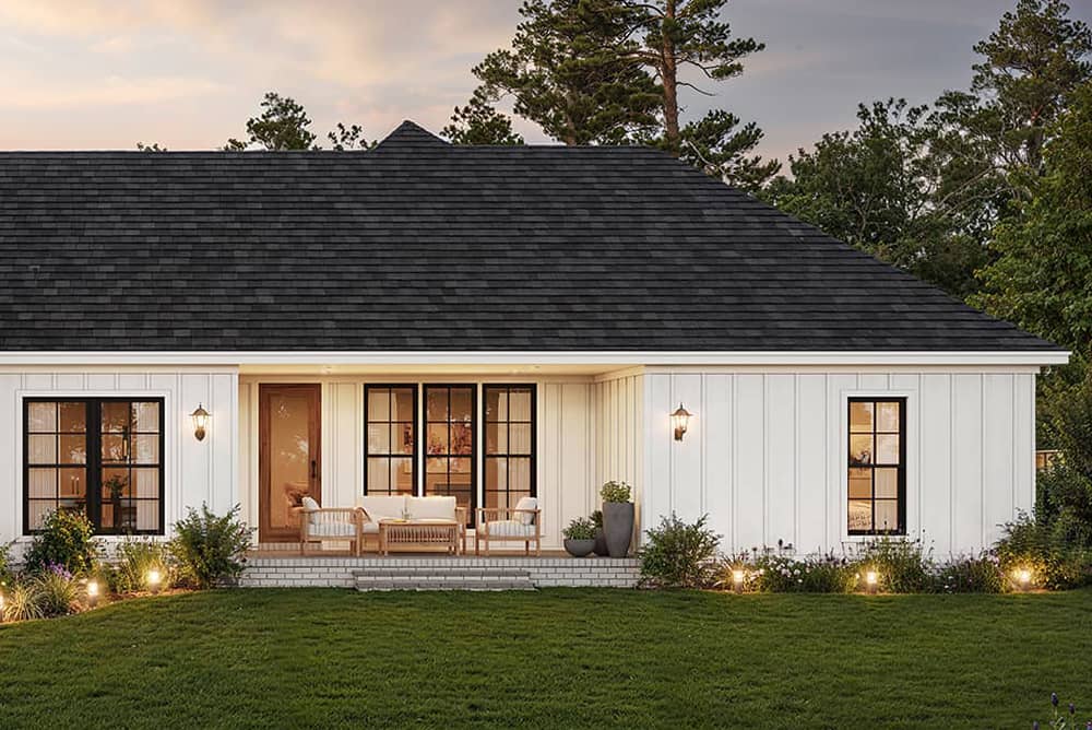 Rear covered patio of Tuscany Style Homes with low-pitched hip roof