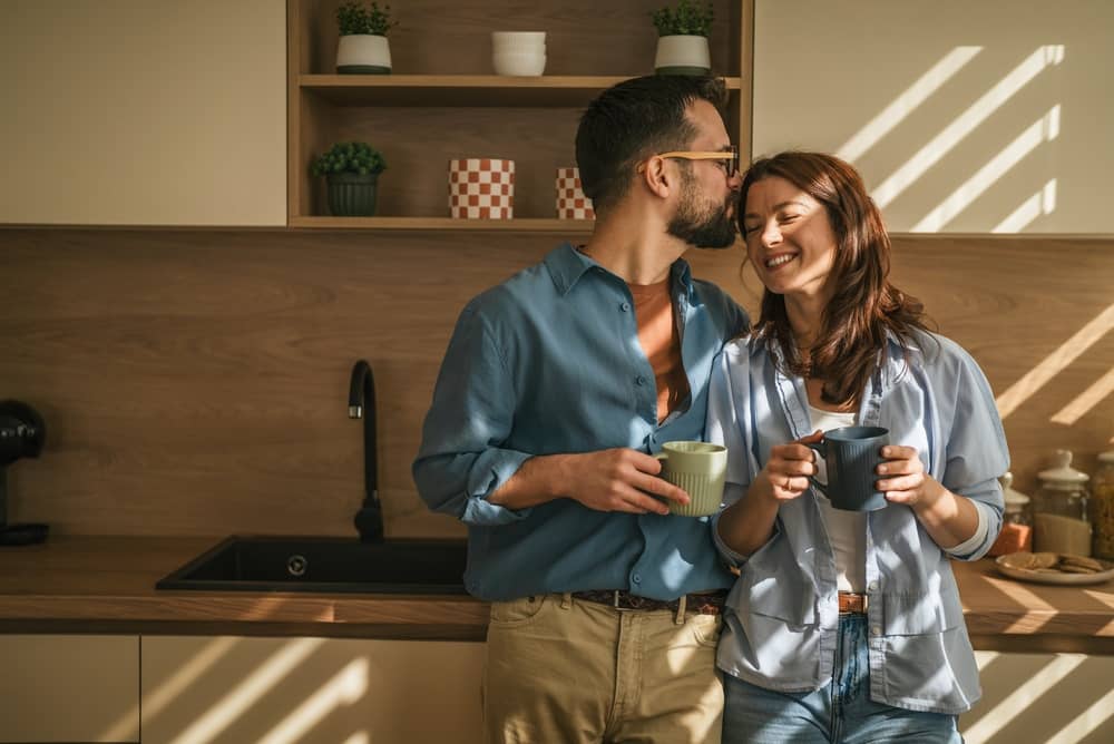 Happy homeowners in their new construction kitchen – Homes for Sale Near Tyler TX